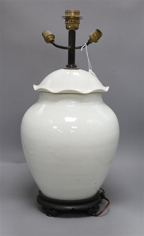 A Chinese white glazed porcelain jar and cover, late 19th/early 20th century, mounted as a lamp H.57.5cm